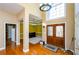 Two-story foyer with hardwood floors and double doors at 3955 Three Chimneys Ln, Cumming, GA 30041