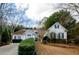 Two-story house with a landscaped yard and driveway at 3955 Three Chimneys Ln, Cumming, GA 30041