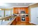 Kitchen with granite countertops and stainless steel appliances at 3955 Three Chimneys Ln, Cumming, GA 30041