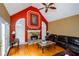 Living room with vaulted ceiling, fireplace, and hardwood floors at 3955 Three Chimneys Ln, Cumming, GA 30041