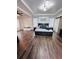 Large main bedroom with dark wood-look floors and stylish decor at 408 Blue Sky Cir, Acworth, GA 30102