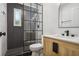 Modern bathroom with herringbone tile shower and updated vanity at 1534 Alma Sw St, Atlanta, GA 30311