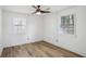 Bright bedroom with hardwood floors and two windows at 1534 Alma Sw St, Atlanta, GA 30311