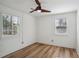 Bright bedroom with hardwood floors and two windows at 1534 Alma Sw St, Atlanta, GA 30311