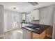 Modern kitchen with dark countertops and white cabinets at 1534 Alma Sw St, Atlanta, GA 30311