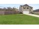 Spacious backyard with a wooden privacy fence and a patio at 3720 Liverpool Way, Atlanta, GA 30331