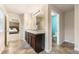 Elegant bathroom with double sinks, a separate shower, and a view into the bedroom at 3720 Liverpool Way, Atlanta, GA 30331