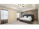 Spacious Primary bedroom with a large bed and wood-like accent wall at 3720 Liverpool Way, Atlanta, GA 30331