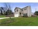 Two-story house with gray siding, a white garage door, and a landscaped yard at 3720 Liverpool Way, Atlanta, GA 30331