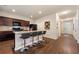 Modern kitchen with island, granite countertops, and breakfast bar at 3720 Liverpool Way, Atlanta, GA 30331