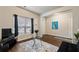 Living room with hardwood floors, large window, and comfy seating at 3720 Liverpool Way, Atlanta, GA 30331