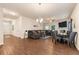 Open concept living area with hardwood floors and a dining area at 3720 Liverpool Way, Atlanta, GA 30331