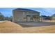 Large backyard with covered patio is ready for your personal touch at 501 Dolce Rd, Locust Grove, GA 30248