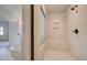 Modern bathroom featuring a frameless shower with bench and separate soaking tub at 501 Dolce Rd, Locust Grove, GA 30248