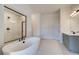 Bathroom features a freestanding tub and a glass-enclosed shower at 501 Dolce Rd, Locust Grove, GA 30248