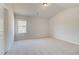 Bedroom with neutral carpet and a window at 501 Dolce Rd, Locust Grove, GA 30248