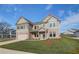 Charming two-story home featuring a brick and siding facade, as well as a spacious two-car garage at 501 Dolce Rd, Locust Grove, GA 30248