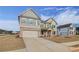 Stunning two-story home showcasing a brick and siding facade, as well as a spacious two-car garage at 501 Dolce Rd, Locust Grove, GA 30248