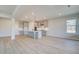 Modern kitchen featuring a center island, stainless appliances, hardwood floors and recessed lights at 501 Dolce Rd, Locust Grove, GA 30248