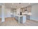 Stylish kitchen featuring gray cabinets, stainless appliances, large island, and recessed lighting at 501 Dolce Rd, Locust Grove, GA 30248
