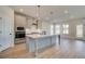 Bright kitchen featuring an island, stainless appliances, ample natural light and access to the backyard at 501 Dolce Rd, Locust Grove, GA 30248