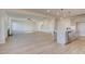 Open-concept living and kitchen area featuring hardwood floors, recessed lighting, and stainless appliances at 501 Dolce Rd, Locust Grove, GA 30248