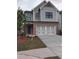 Charming two-story home with a two-car garage, brick accents and a beautifully landscaped front yard at 1070 Crest Mill Dr, Marietta, GA 30008