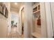 Inviting hallway with wood floors leads to a mudroom-style drop zone with storage and seating at 2760 Rustic Lake Ter, Cumming, GA 30041