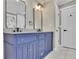 Elegant bathroom with double vanity and blue cabinets at 4913 Windsor Downs Dr, Decatur, GA 30035