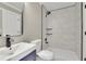 Modern bathroom with marble-tiled shower and vanity at 4913 Windsor Downs Dr, Decatur, GA 30035