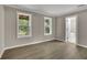 Bedroom with wood-look floors and access to a bathroom at 4913 Windsor Downs Dr, Decatur, GA 30035