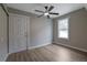 Well-lit bedroom with new flooring and an exterior view at 4913 Windsor Downs Dr, Decatur, GA 30035