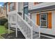 Front entrance with gray stairs and white railing at 4913 Windsor Downs Dr, Decatur, GA 30035