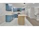 Modern kitchen with blue cabinets and island at 4913 Windsor Downs Dr, Decatur, GA 30035