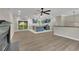 Open concept living room with kitchen and island at 4913 Windsor Downs Dr, Decatur, GA 30035