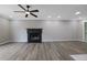 Spacious living room featuring a fireplace and wood-look floors at 4913 Windsor Downs Dr, Decatur, GA 30035