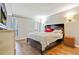 Bedroom with queen-size bed and wood floors at 5031 Woodridge Way, Tucker, GA 30084