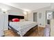 Main bedroom with a king-size bed and wood floors at 5031 Woodridge Way, Tucker, GA 30084