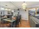 Elegant dining room with glass table and black chairs at 5031 Woodridge Way, Tucker, GA 30084