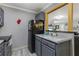Small kitchen with gray cabinets and marble countertops at 5031 Woodridge Way, Tucker, GA 30084
