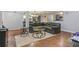 Spacious living room featuring a large sectional sofa and wood-look floors at 5031 Woodridge Way, Tucker, GA 30084