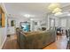 Open living area with sectional sofa, fireplace, and wood floors at 5031 Woodridge Way, Tucker, GA 30084