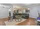 Spacious living room featuring a large sectional sofa and wood-look floors at 5031 Woodridge Way, Tucker, GA 30084