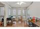 Sunroom with wood floors, and multiple windows at 5031 Woodridge Way, Tucker, GA 30084