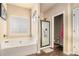 Bathroom with soaking tub, walk-in shower, and double vanity at 100 Canyons Ct, Hampton, GA 30228