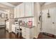 Kitchen desk area with granite countertop and white cabinets at 100 Canyons Ct, Hampton, GA 30228