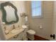 Charming powder room with shiplap walls and a white vanity at 1814 Tristan Se Dr, Smyrna, GA 30080