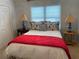 Cozy bedroom with a bed, nightstands and a red blanket at 1814 Tristan Se Dr, Smyrna, GA 30080