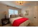 Serene bedroom with a bed, nightstands, and window blinds at 1814 Tristan Se Dr, Smyrna, GA 30080