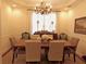 Formal dining room featuring a wood table, chandelier, and neutral color palette at 1814 Tristan Se Dr, Smyrna, GA 30080